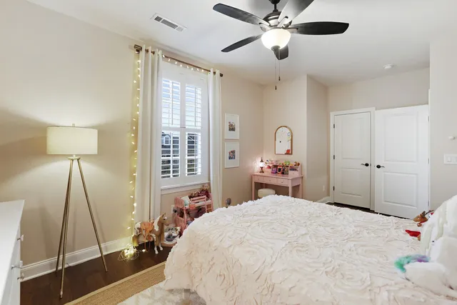 a living room with furniture and a piano