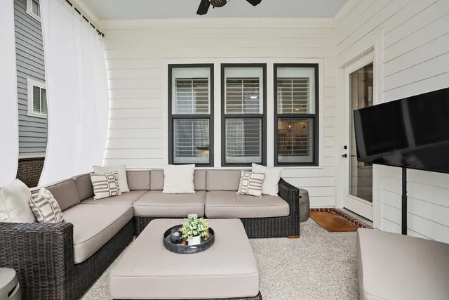 a view of a house with pool and sitting area