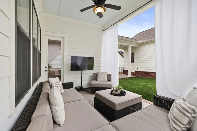 a view of a patio with a yard