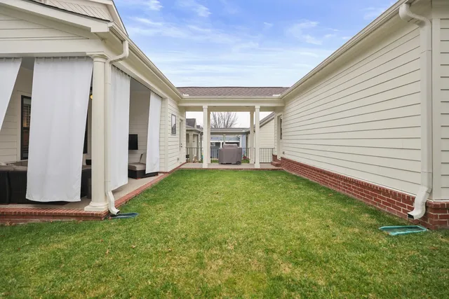 a view of swimming pool is middle in front of the house