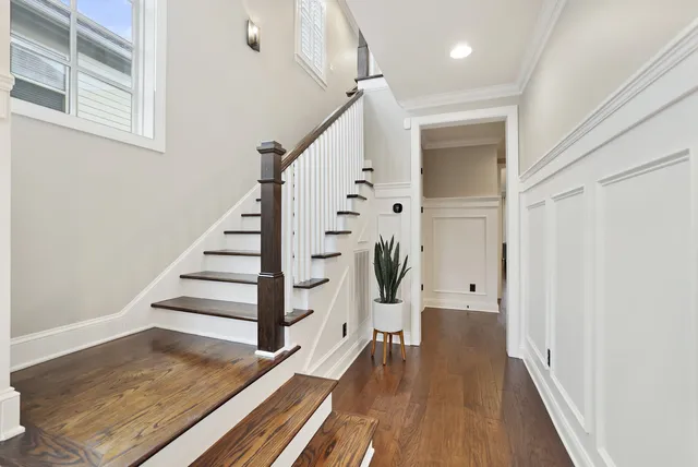 a view of entryway with wooden floor and stairs