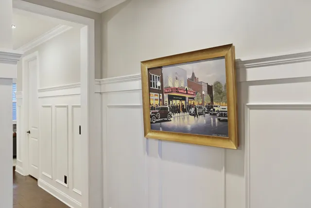 a kitchen with stainless steel appliances kitchen island granite countertop a sink a stove and a wooden floors