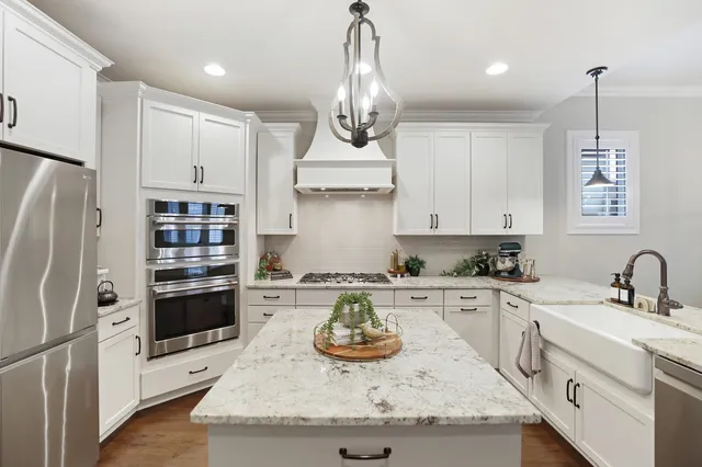 a kitchen with sink and stove