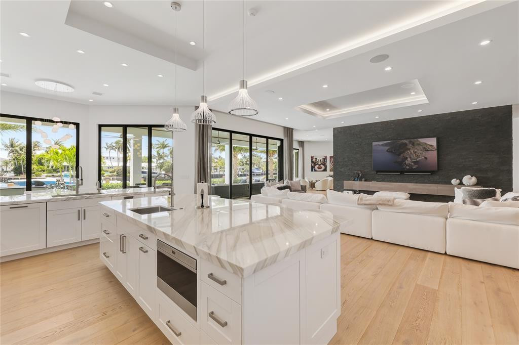 2550 Northeast 31st Court Lighthouse Point, FL 33064 - Photo 18 of 84 a large white kitchen with a large window