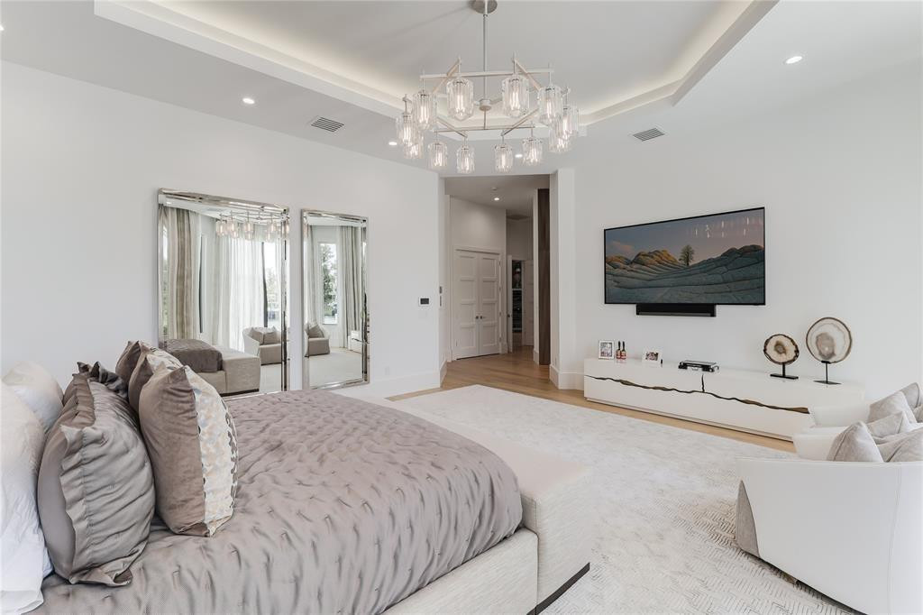 2550 Northeast 31st Court Lighthouse Point, FL 33064 - Photo 40 of 84 a spacious bedroom with a bed and a flat screen tv