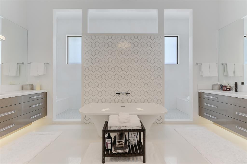 2550 Northeast 31st Court Lighthouse Point, FL 33064 - Photo 42 of 84 a spacious bathroom with a tub sink and mirror
