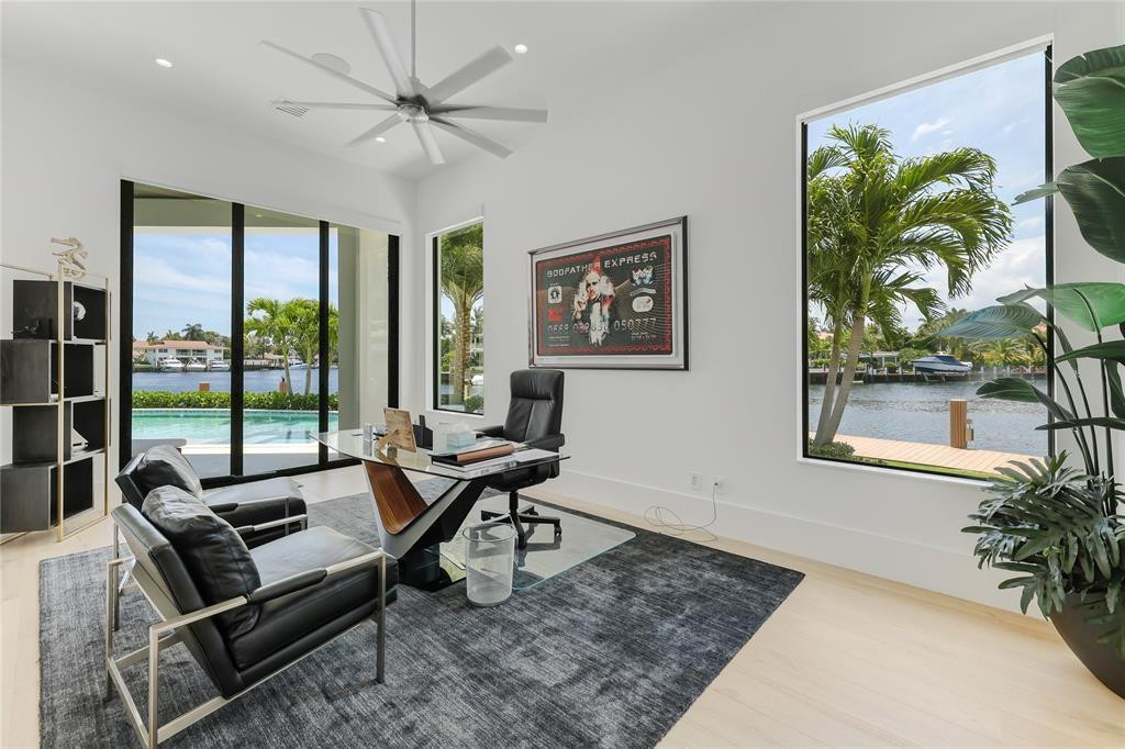 2550 Northeast 31st Court Lighthouse Point, FL 33064 - Photo 48 of 84 a living room with furniture and a large window
