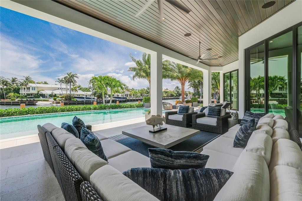 2550 Northeast 31st Court Lighthouse Point, FL 33064 - Photo 64 of 84 a living room with patio furniture and garden