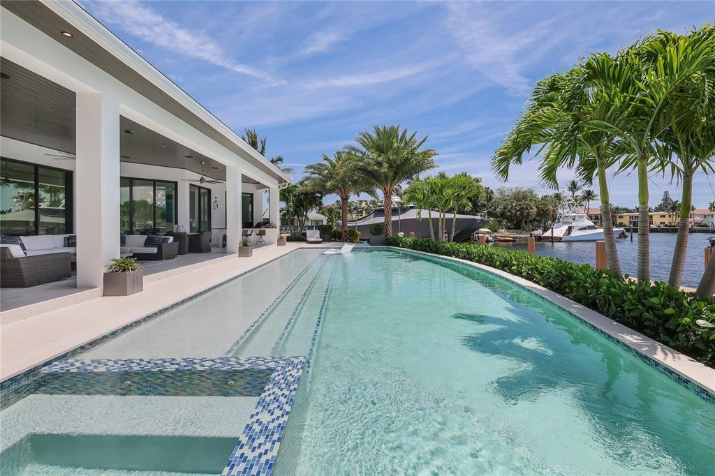 2550 Northeast 31st Court Lighthouse Point, FL 33064 - Photo 65 of 84 a view of a house with swimming pool and sitting area