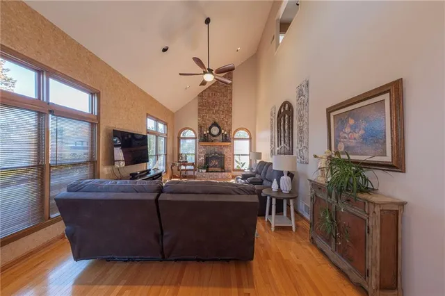 a living room with furniture fireplace and flat screen tv