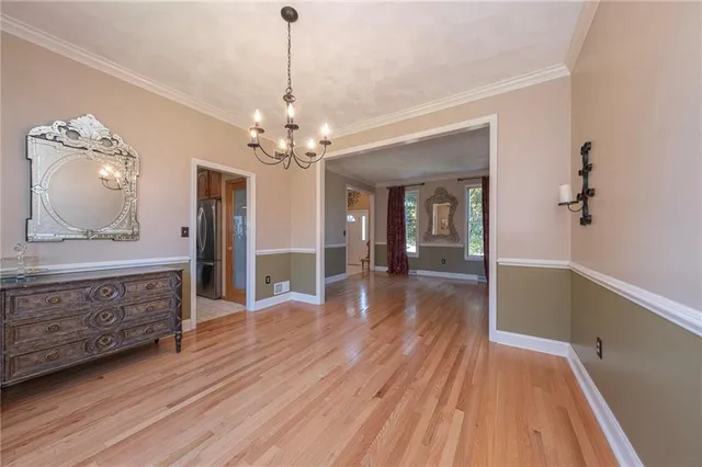 a view of livingroom with kitchen and hardwood