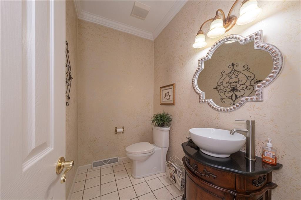 309 Jefferson Street Export, PA 15632 - Photo 23 of 43 a bathroom with a toilet a sink and a mirror