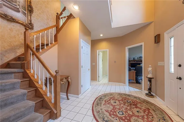 a view of an entryway with wooden floor