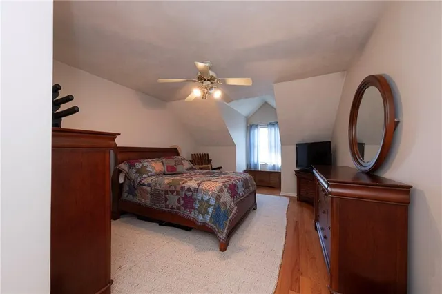 a bed room with a bed and a chandelier