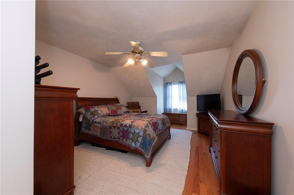 309 Jefferson Street Export, PA 15632 - Photo 32 of 43 a bed room with a bed and a chandelier