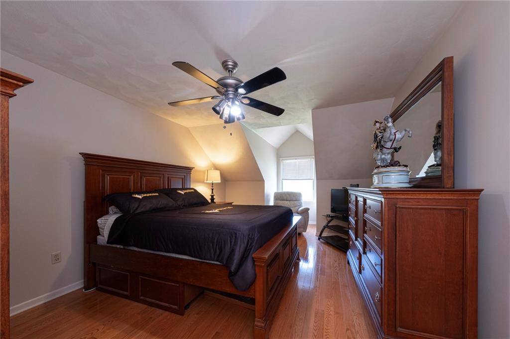 309 Jefferson Street Export, PA 15632 - Photo 33 of 43 a bedroom with a bed and a chandelier