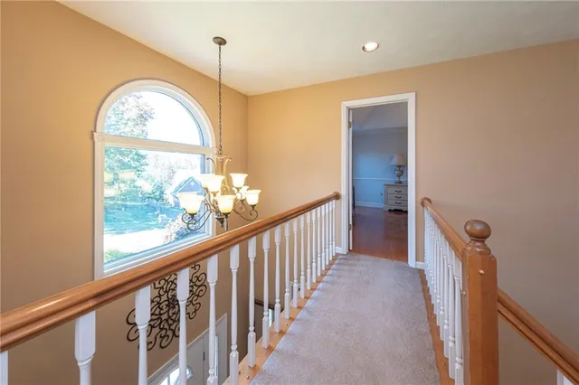 a view of a room with wooden floor and a window