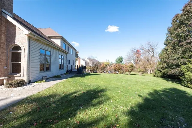 a view of a backyard of the house