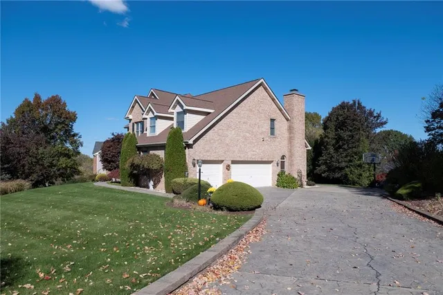 a view of a house with a back yard