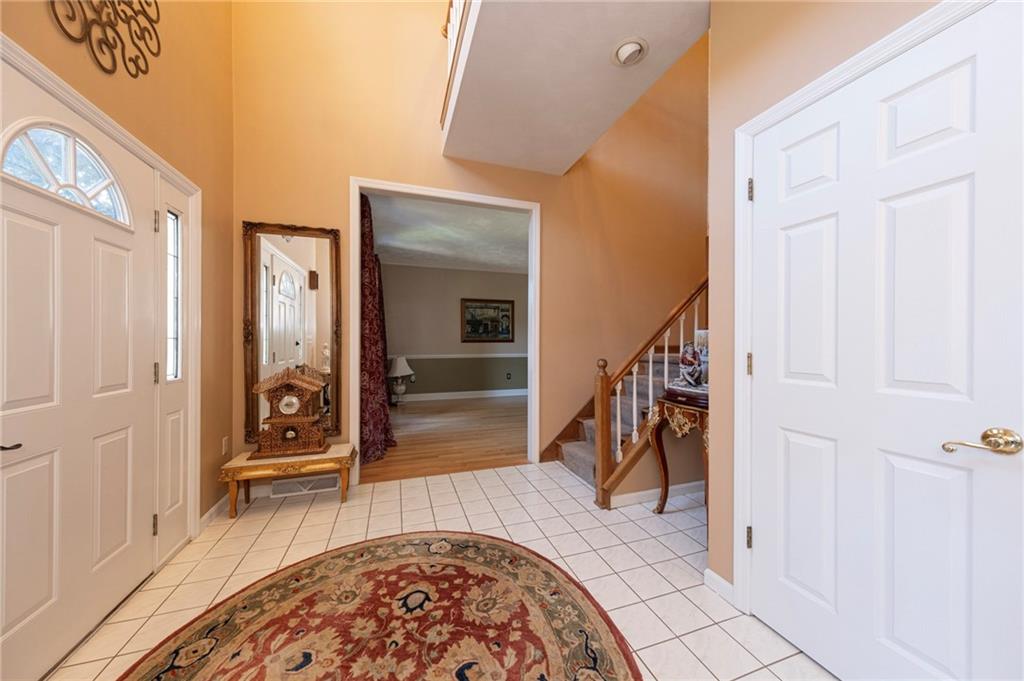 309 Jefferson Street Export, PA 15632 - Photo 8 of 43 a view of a hallway with wooden floor and staircase