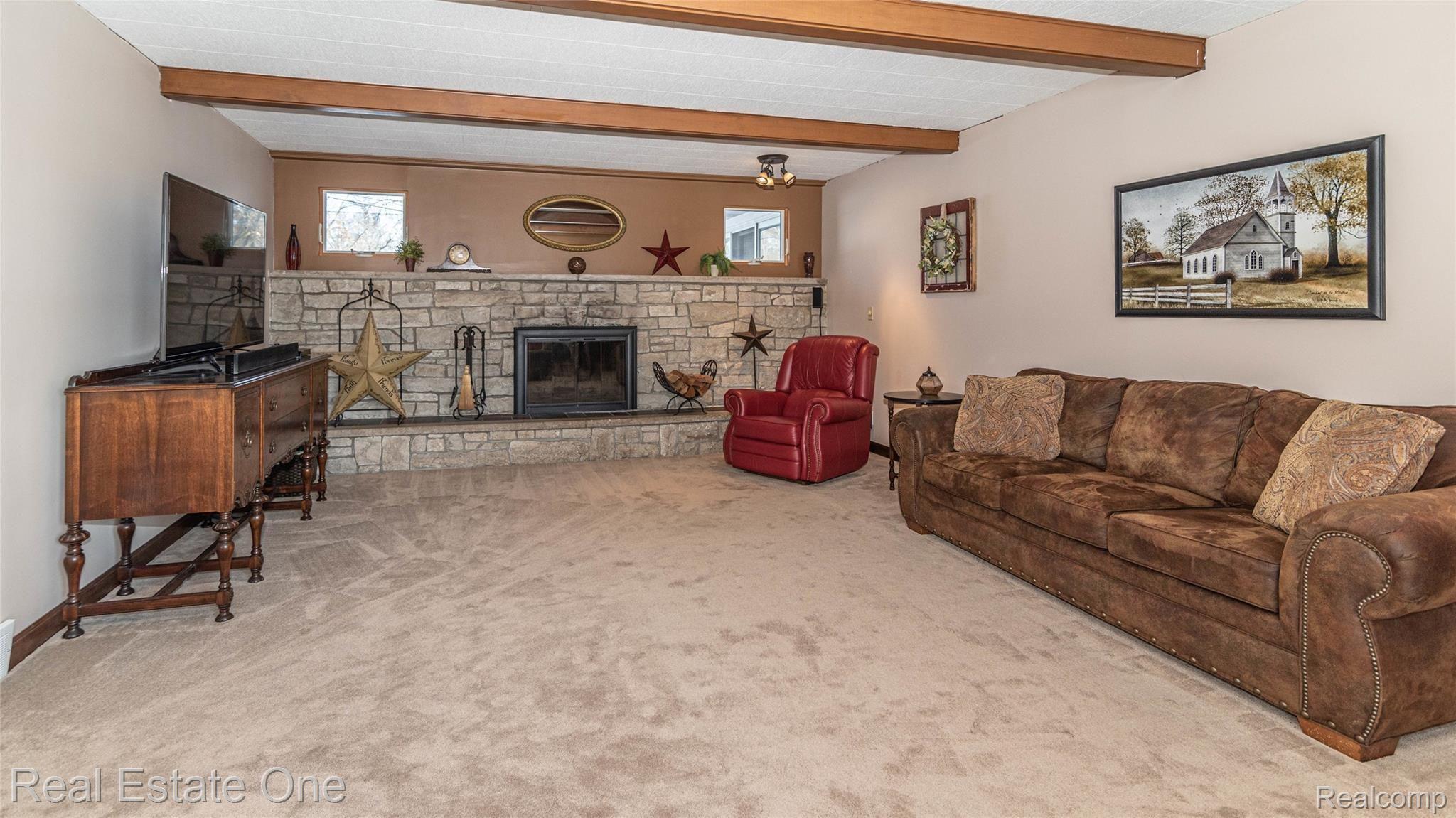 174 Henderson Road Howell, MI 48855 - Photo 13 of 30 BEAUTIFUL NATURAL STONE FIREPLACE /HOW MANY STOCKINGS CAN THIS MANTLE HOLD?