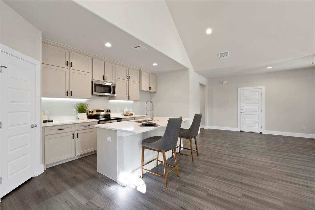 200 Harris Harbor Road East Tawakoni, TX 75472 - Photo 5 of 24 a kitchen with appliances a sink a counter top space and cabinets