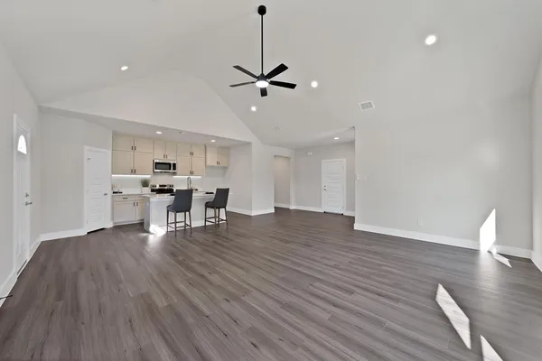 a view of dining room with furniture and wooden floor