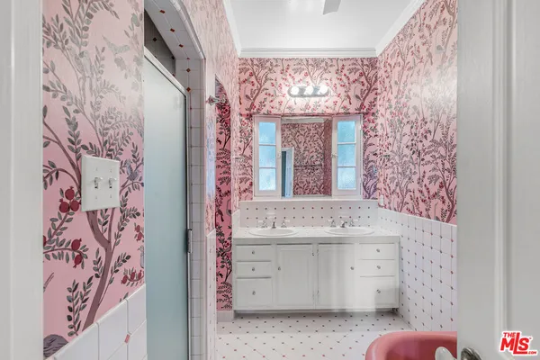 a bathroom with a bathtub and shower