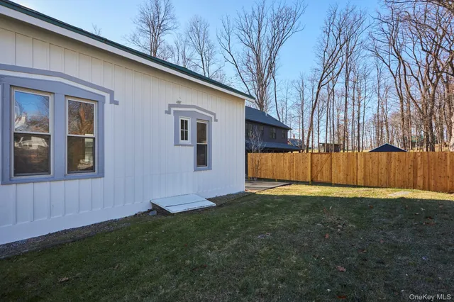 a backyard of a house with lots of green space