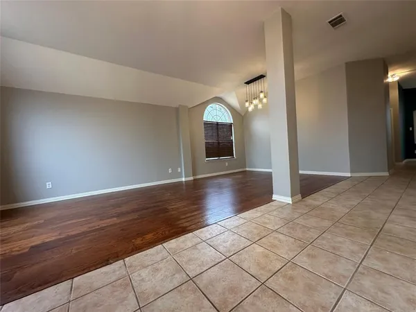 a view of a livingroom with wooden floor