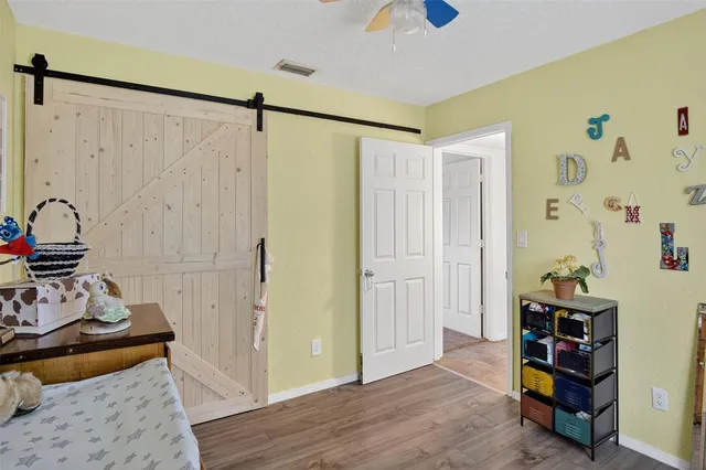 a bathroom with a sink a toilet a mirror and vanity