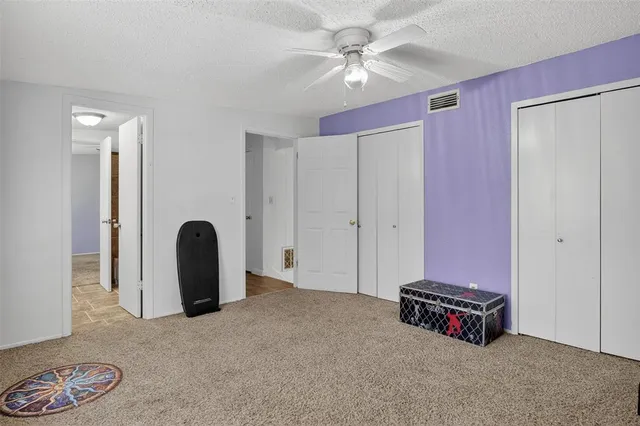 a bathroom with a tub a sink and a window