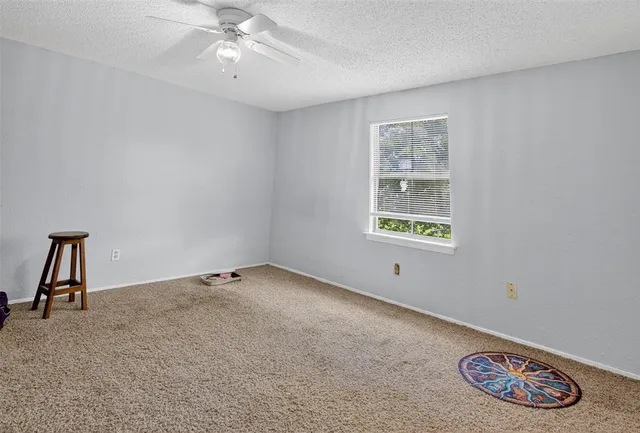 a bathroom with a sink vanity and a toilet