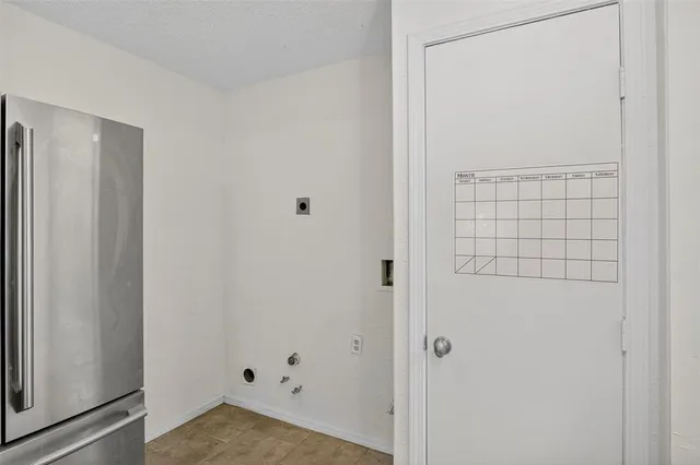 a front view of house with a garden