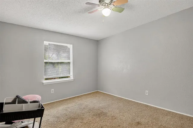 a view of a bedroom with wooden floor and closet