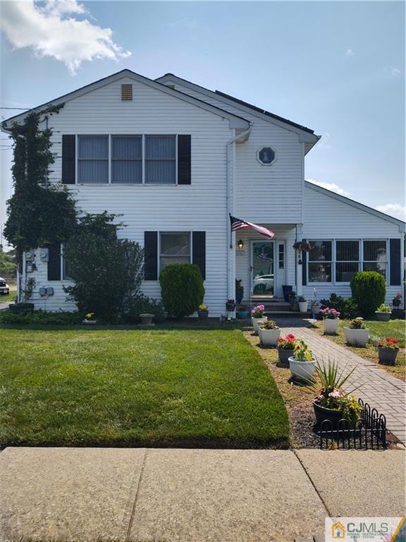 126 Moretti Lane Edison, NJ 08817 - Photo 1 of 33 a front view of a house with garden