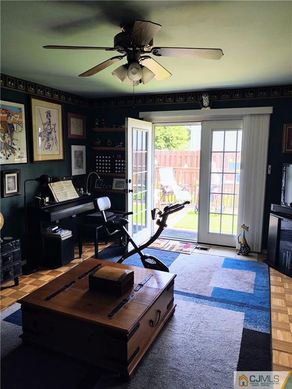 126 Moretti Lane Edison, NJ 08817 - Photo 20 of 33 a living room with furniture a flat screen tv and a large window