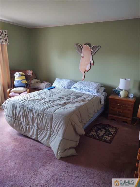 126 Moretti Lane Edison, NJ 08817 - Photo 22 of 33 a bedroom with a bed and a lamp on dresser