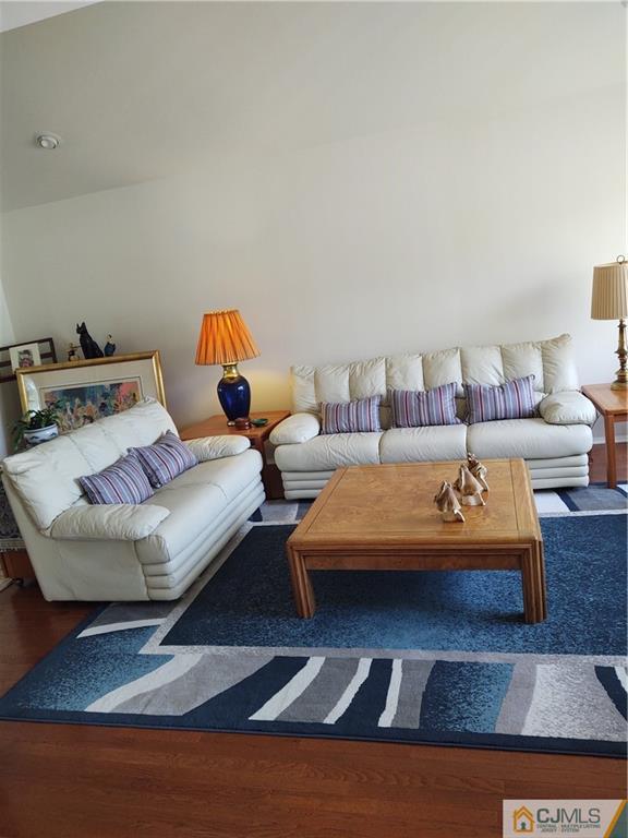 126 Moretti Lane Edison, NJ 08817 - Photo 7 of 33 a living room with furniture and a rug