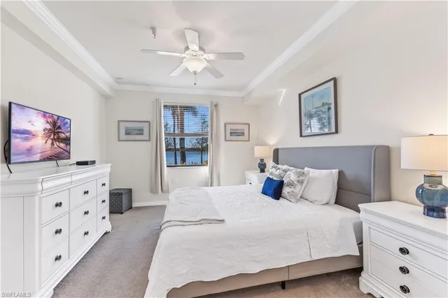 a bedroom with furniture and a chandelier