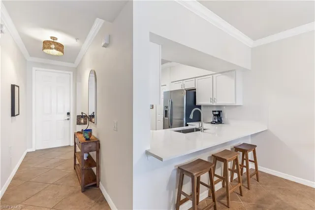 a kitchen that has a table and chairs in it