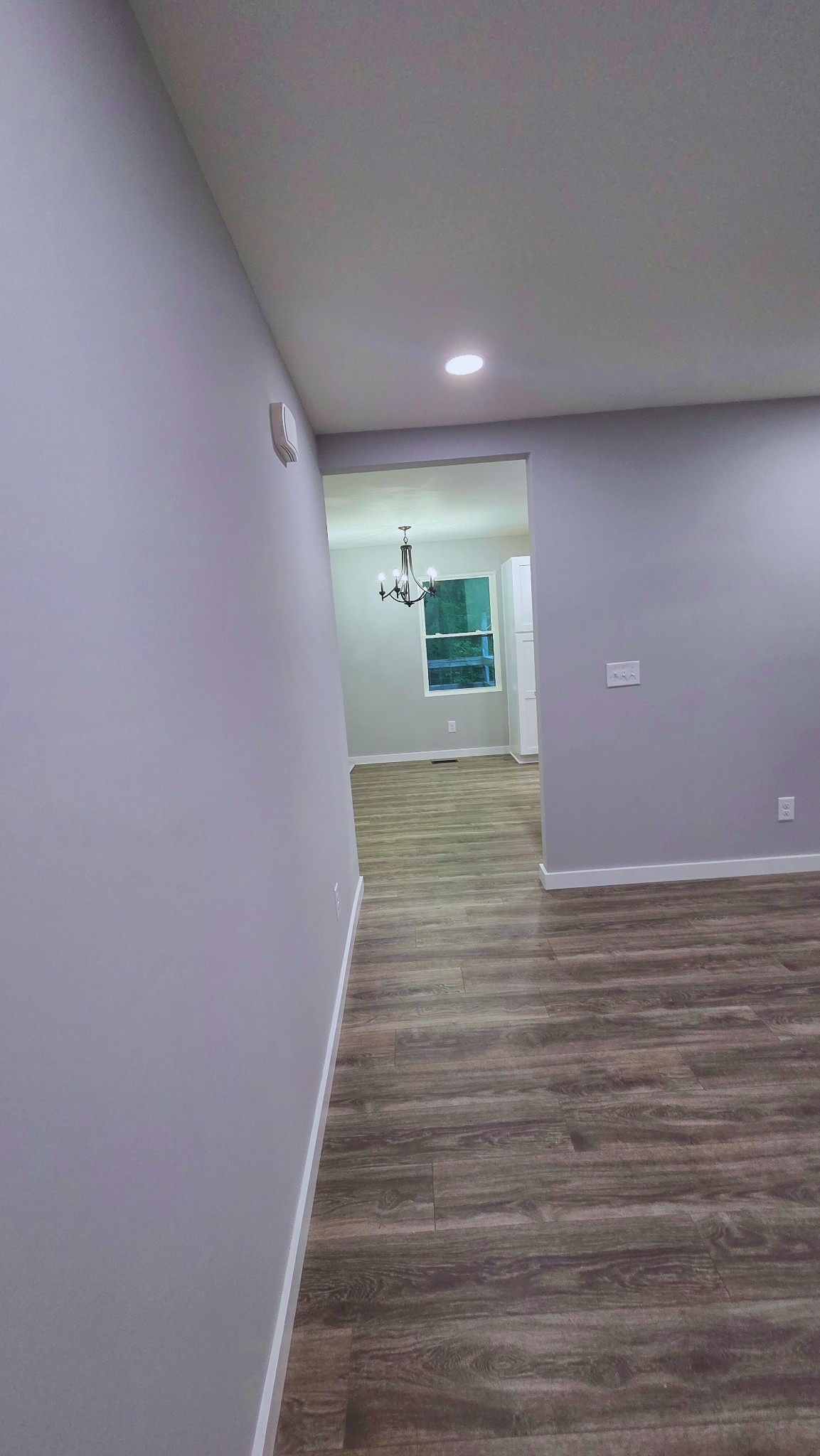 1080 Veterans Road Ashland City, TN 37015 - Photo 13 of 35 a view of an empty room with wooden floor and a window