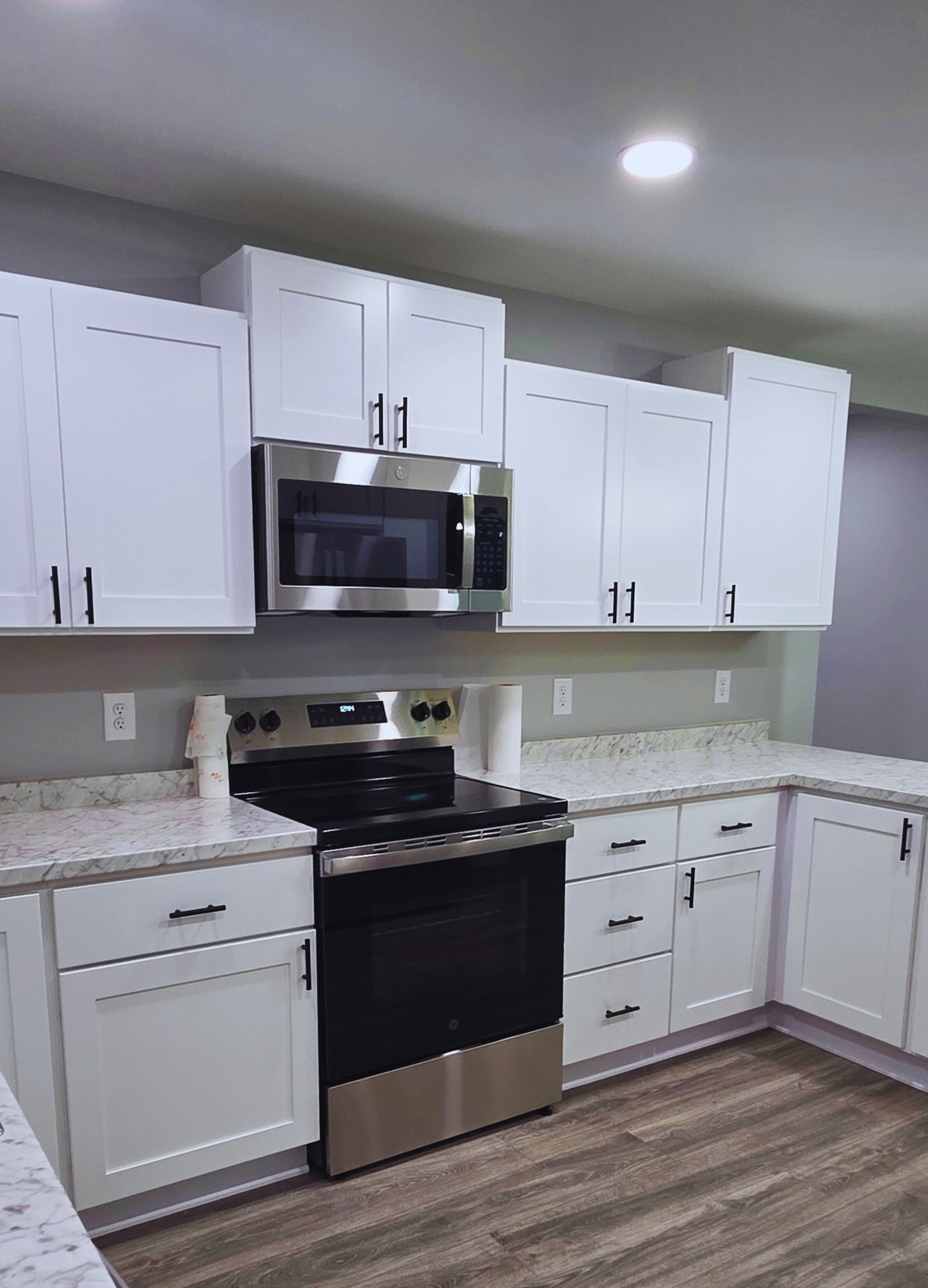 1080 Veterans Road Ashland City, TN 37015 - Photo 20 of 35 a kitchen with white cabinets stainless steel appliances and sink