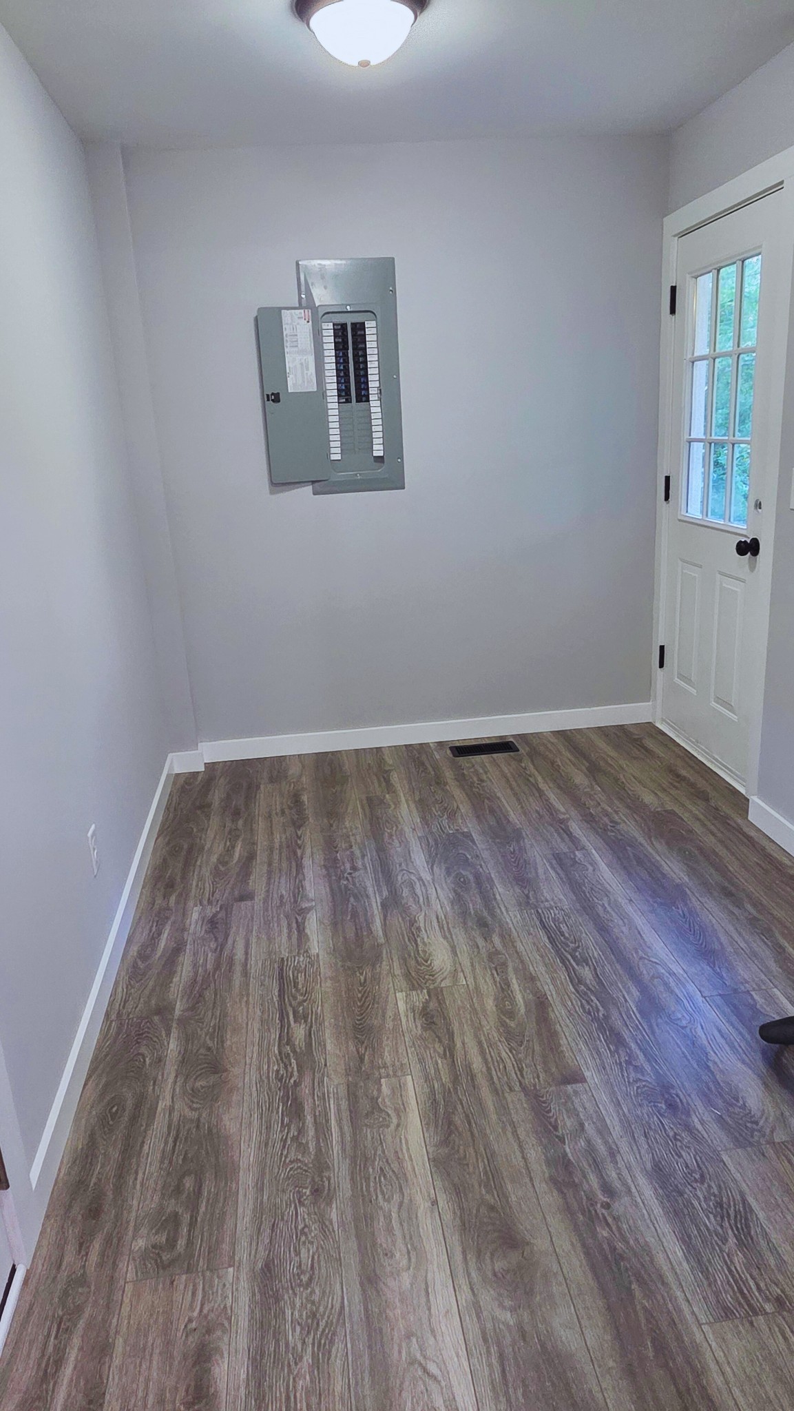 1080 Veterans Road Ashland City, TN 37015 - Photo 22 of 35 a view of a room with wooden floor and windows