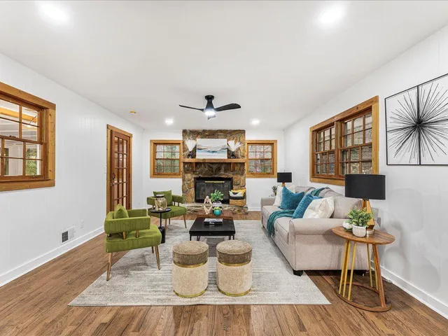 a living room with furniture and a large window