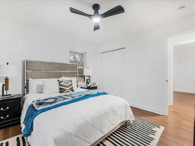 a bedroom with a bed and a view of bathroom