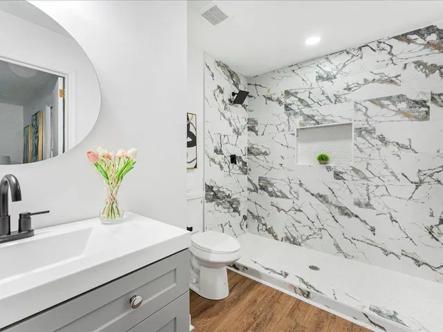 a bathroom with a sink and a mirror