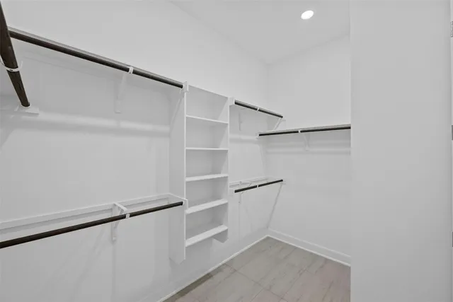 a view of an empty walk in closet