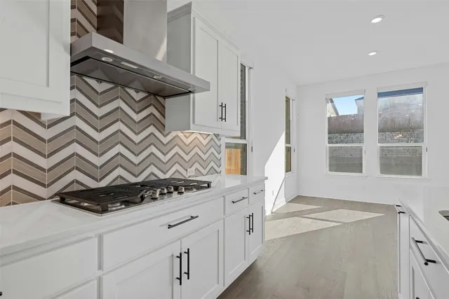 a view of an entryway with cabinets