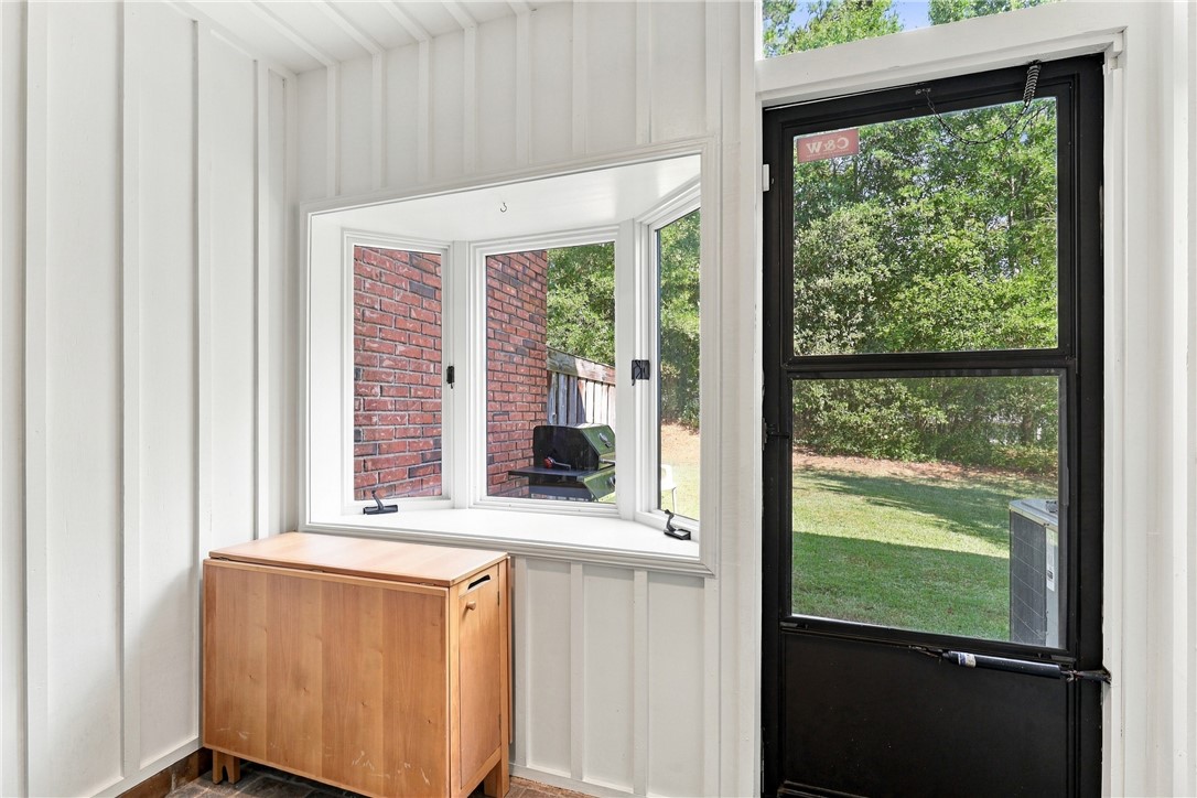 7 Woodbridge Circle Anderson, SC 29621 - Photo 13 of 26 Board and batten walls frame a bright bay window overlooking the backyard lawn.